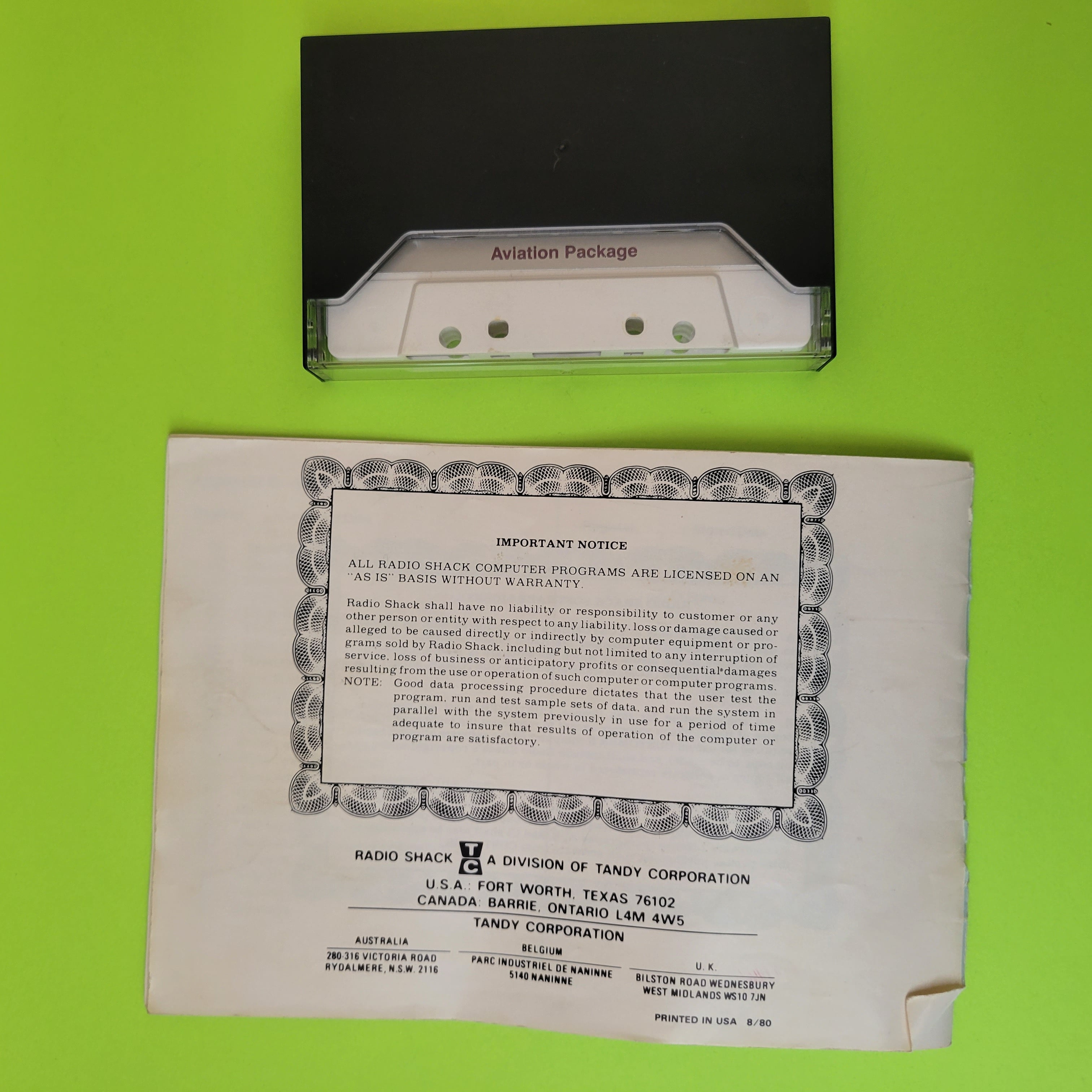 An image of the back of a Radio Shack TRS-80 aviation cassette and manuel